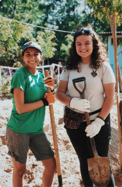 Photo of Two Women with Shovels